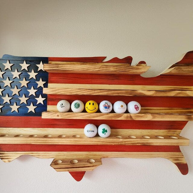 USA flag golfball display case shaped like the United States with slots holding golf balls