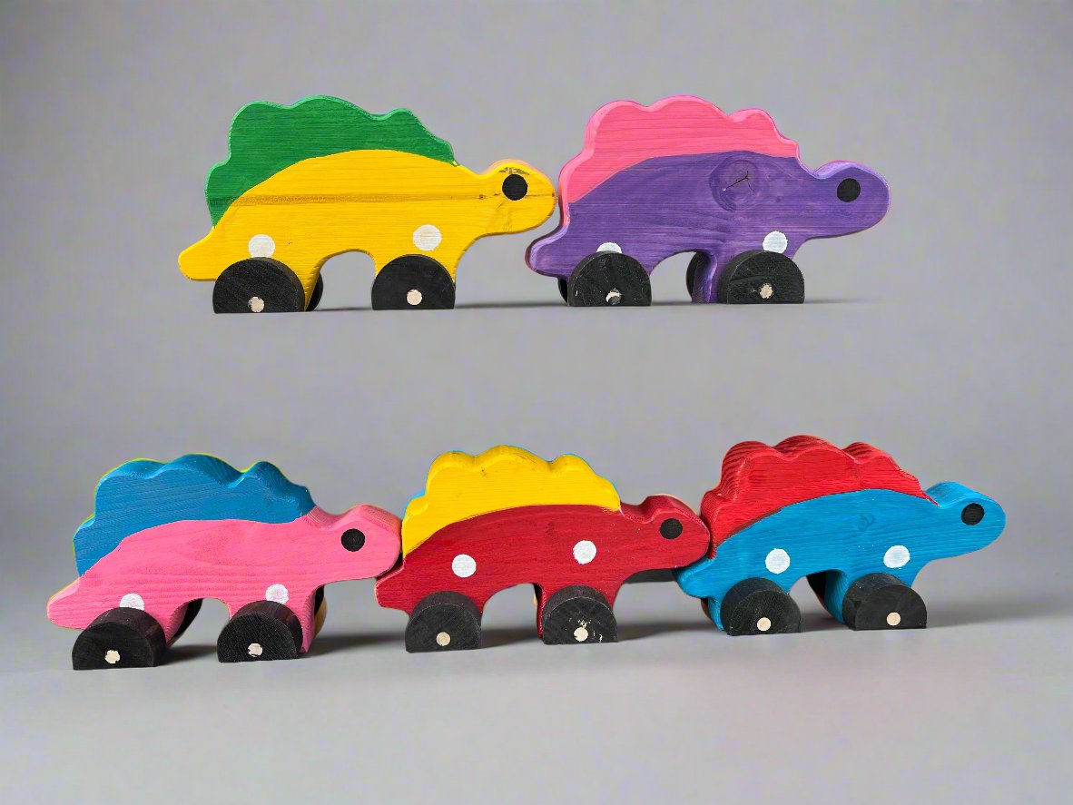 Colorful handcrafted dinosaur kids pull toy set with wooden wheels in various bright colors