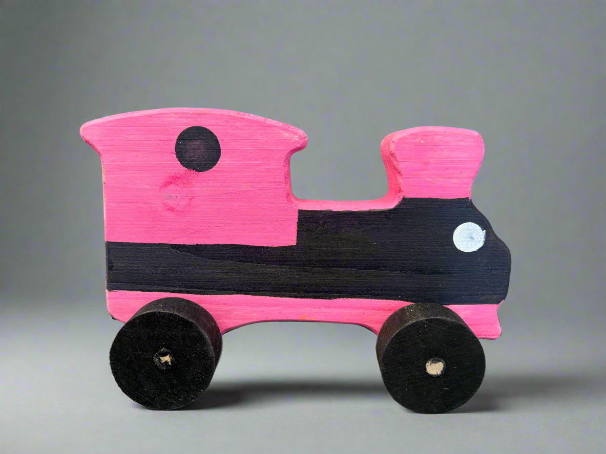 Handcrafted wooden train kids pull toy painted in pink and black with simple design and four wheels