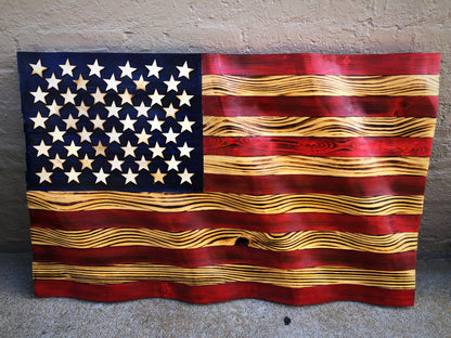 Rustic American flag wall art with carved wooden stars and stripes in red, white, and blue