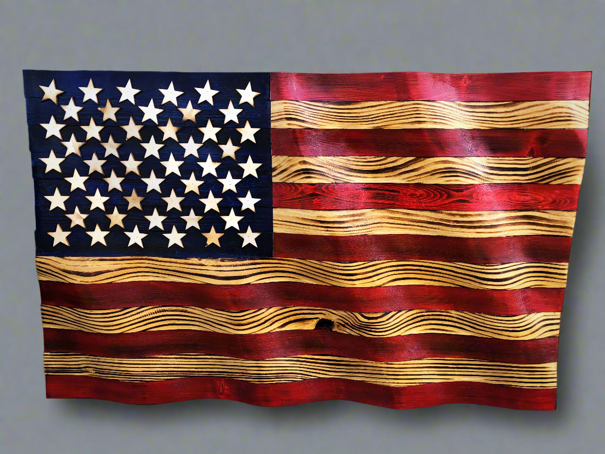 Rustic American flag wall art made of carved wood with distressed red, white, and blue finish