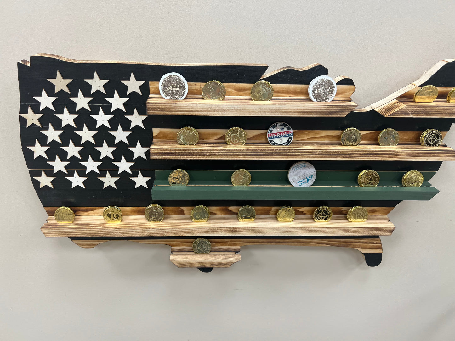 Thin green line wooden flag challenge coin holder wall display with multiple challenge coins