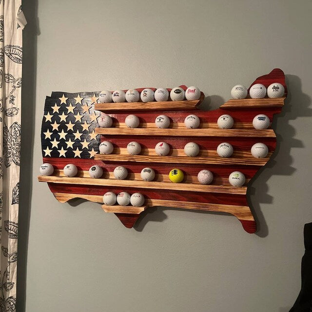 USA flag golfball display case in shape of United States holding multiple golf balls on wooden shelves