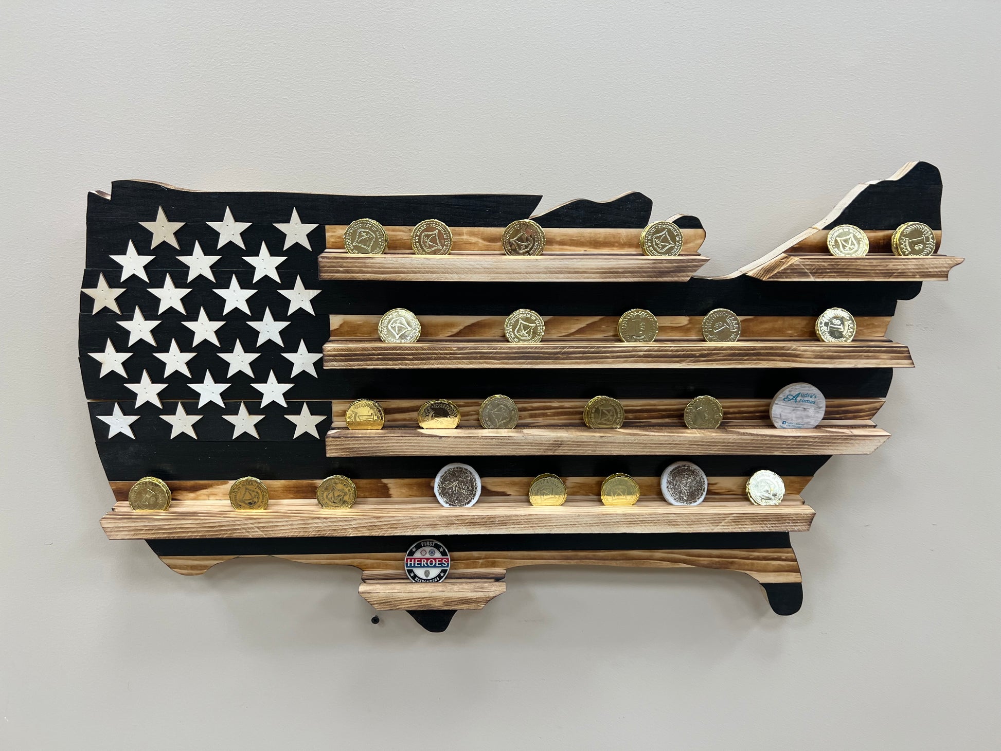USA subdued challenge coin display flag in shape of United States with wooden shelves and coins