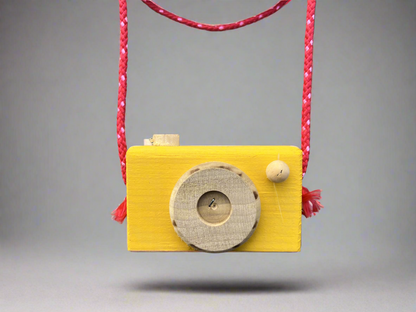 Handmade kids wooden camera painted yellow with red strap perfect for imaginative play