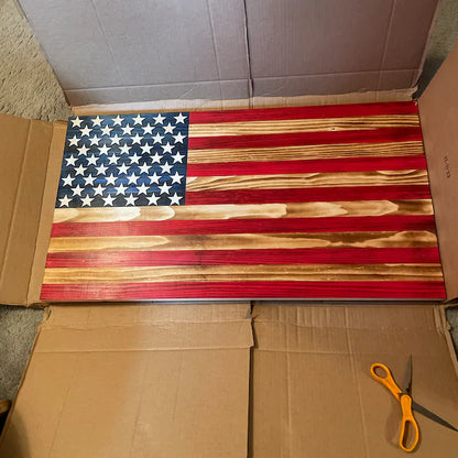 Wooden American Flag with natural wood grain finish and painted red stripes and blue stars