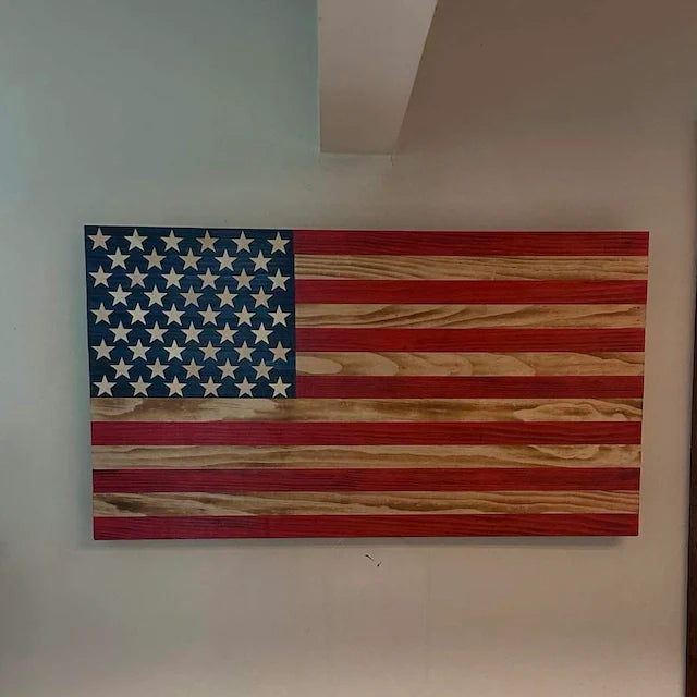 Handcrafted wooden American Flag wall art with natural wood grain and painted stars and stripes