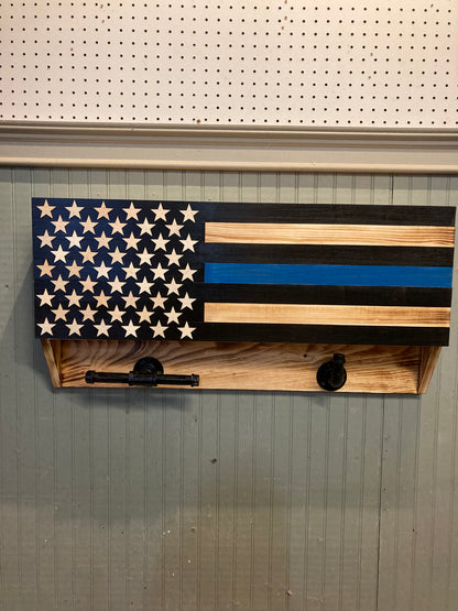 Wooden blue line front door box with American flag design and star cutouts mounted on wall