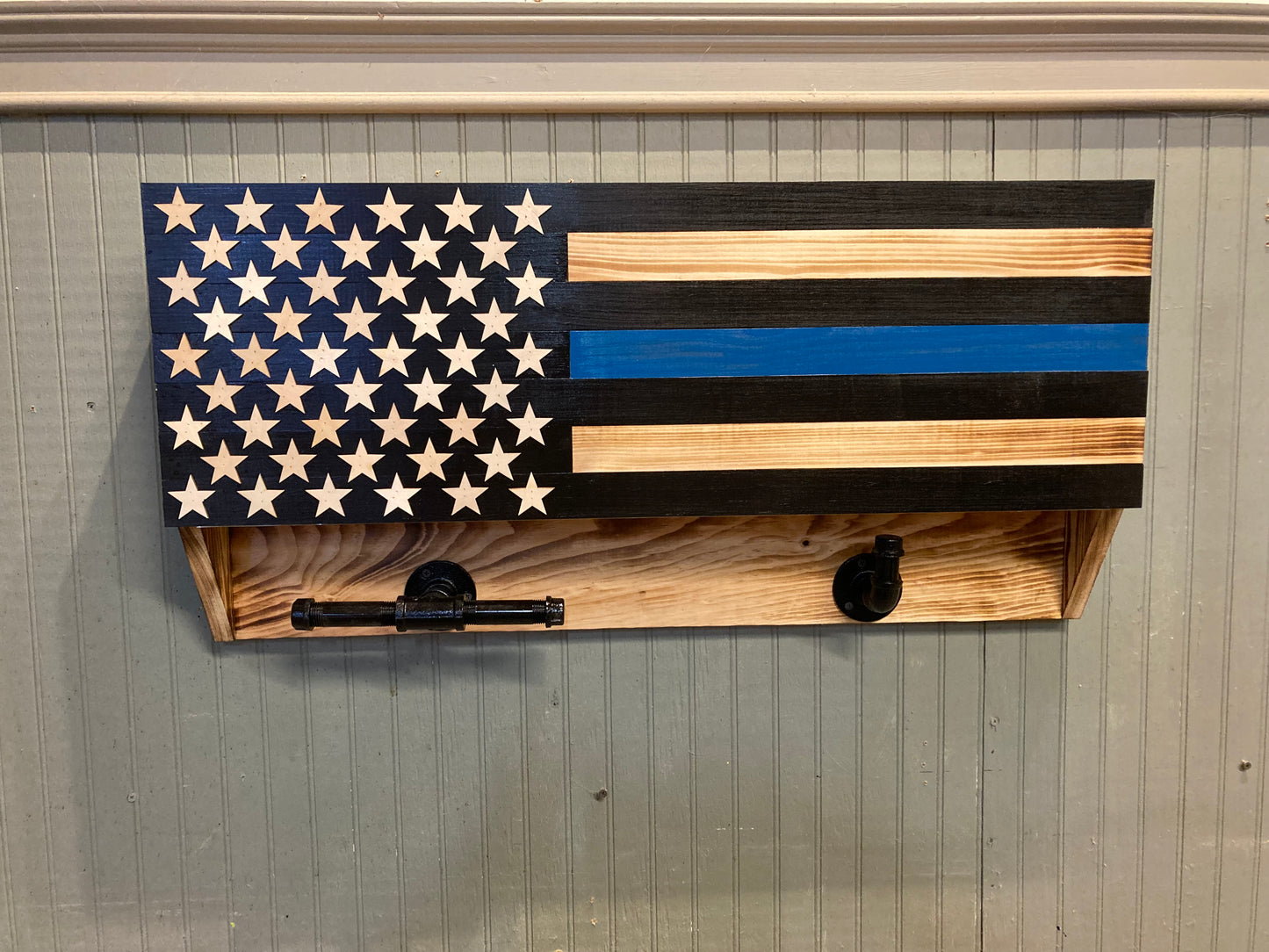 Wooden blue line front door box with American flag design and hooks for hanging items
