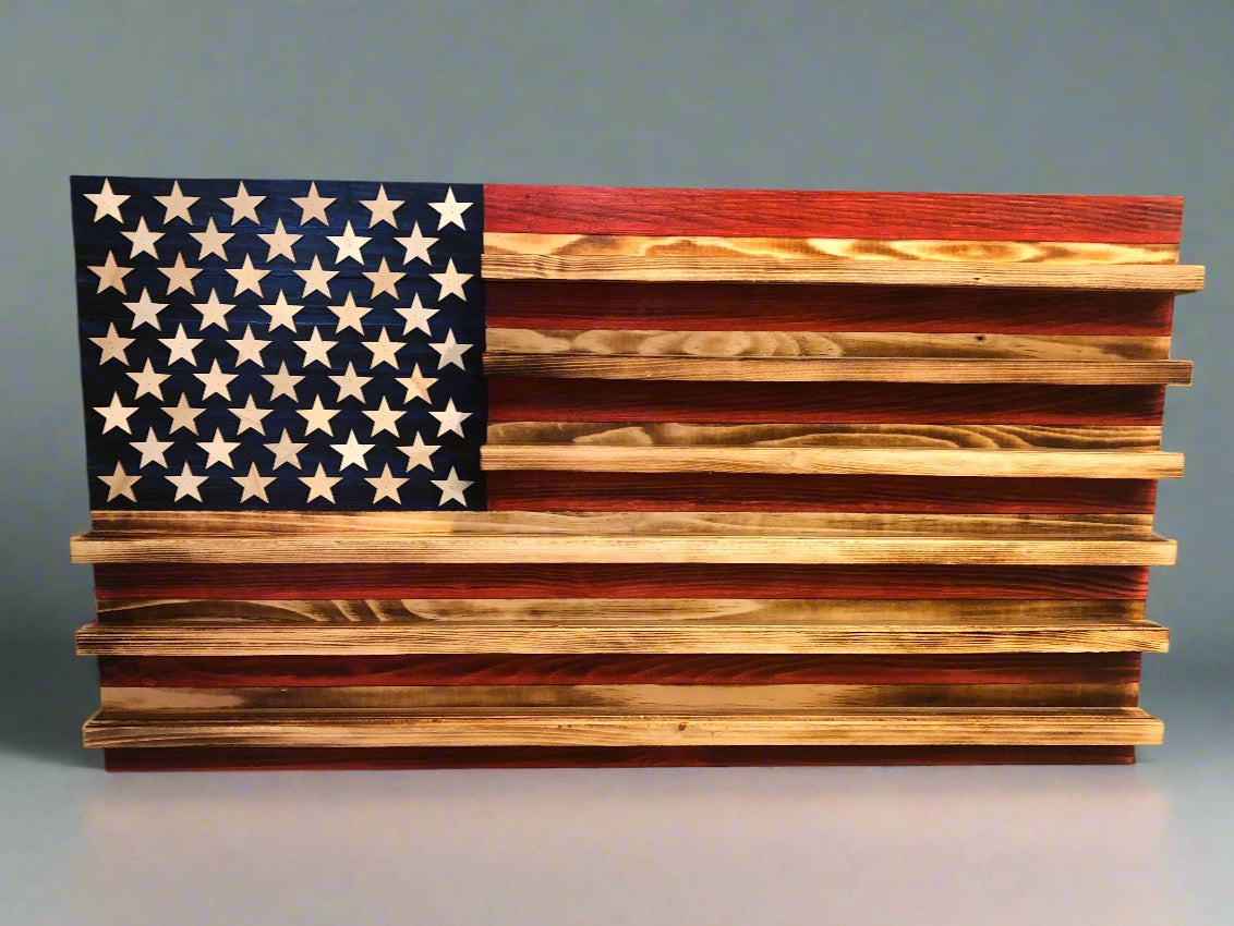 Wooden challenge coin holder flag wall art featuring an American flag design with star cutouts and multiple coin display slots